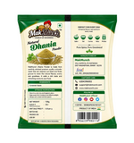 Back of a package of MakMunch Natural Dhania Powder, showing product details, ingredients, storage instructions, manufacturer contact info, and a barcode on a white background.
